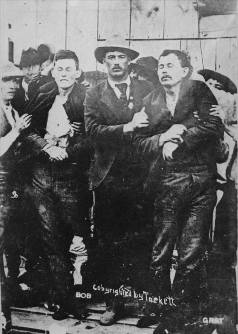 Historic photograph taken in the aftermath of the October 5, 1892 Dalton Gang raid in Coffeyville, Kansas, showing the scene in Death Alley following the gunfight
